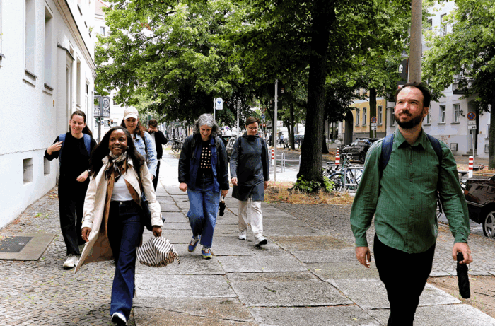 Some of the Centre team walking on a footpath in Berlin