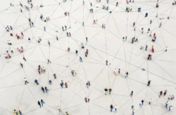 Visual looking down on people connected by networked lines on the ground