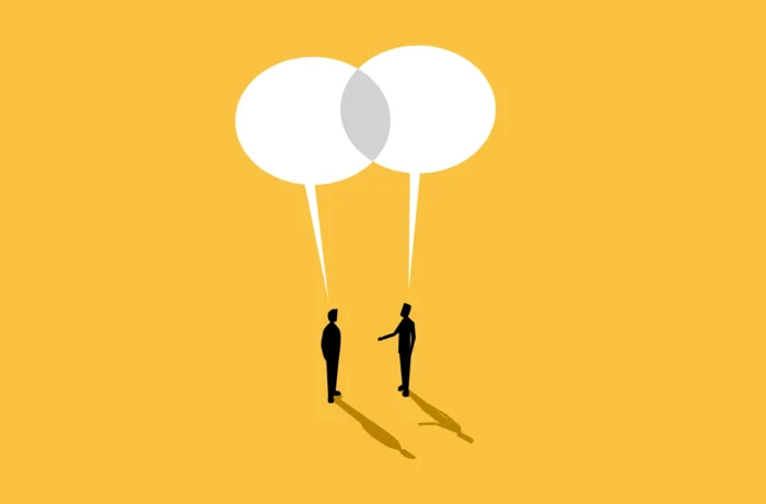 Visual illustration with a yellow background, two silhouette men below two white speech bubbles